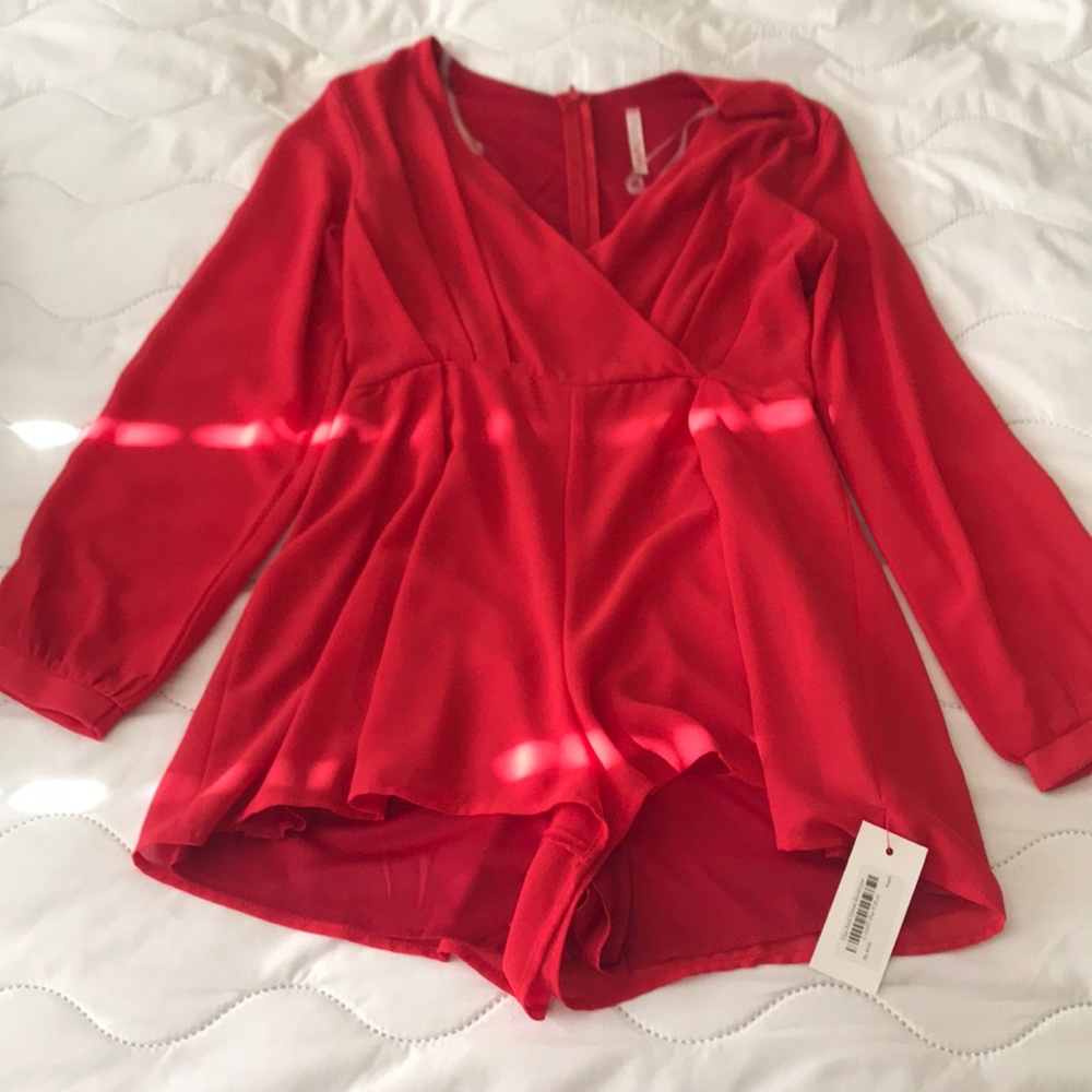 Never worn red romper.